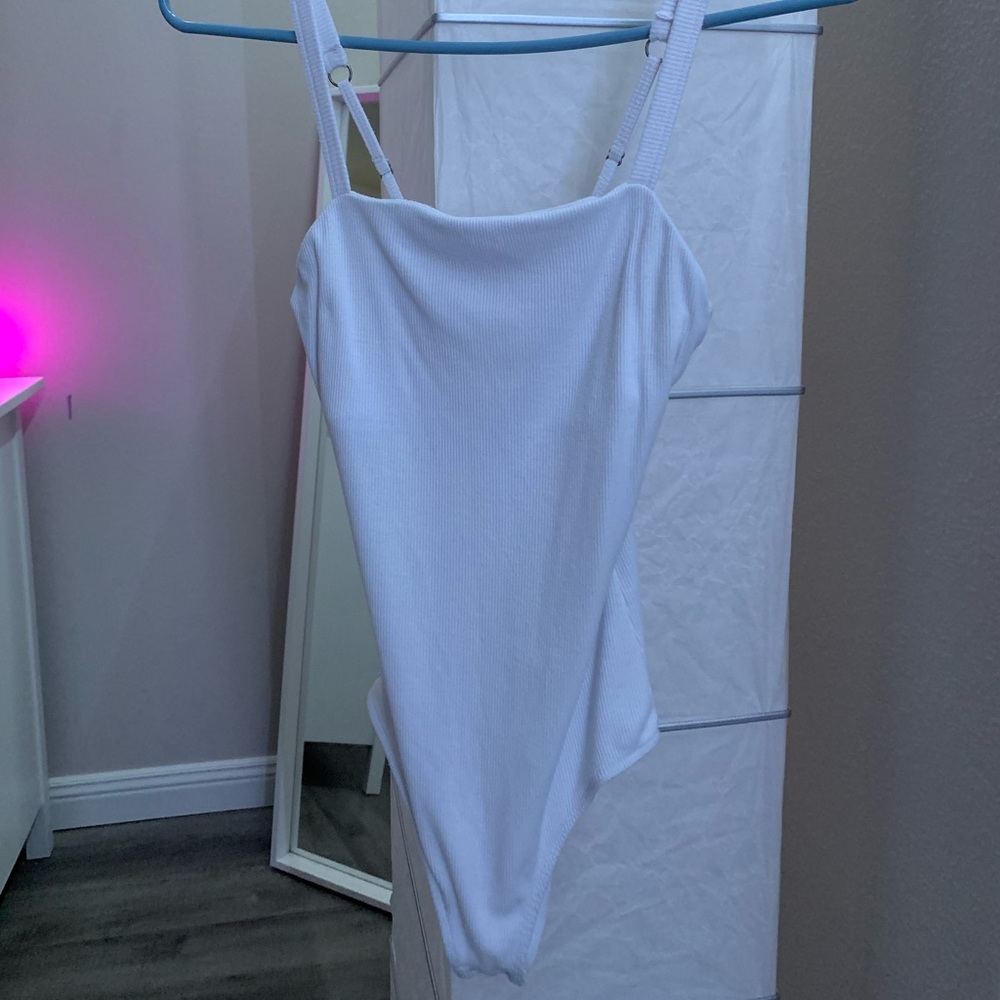 White bodysuit in brand new condition